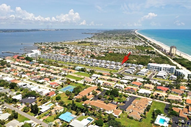 aerial view featuring a view of the beach and a water view