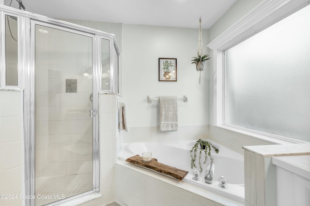 bathroom featuring plus walk in shower