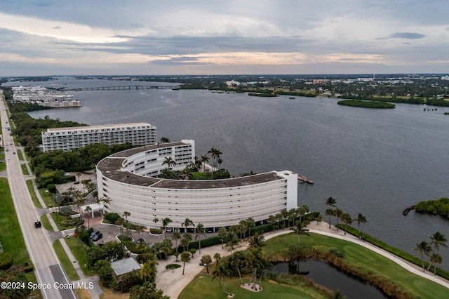 aerial view at dusk with a water view