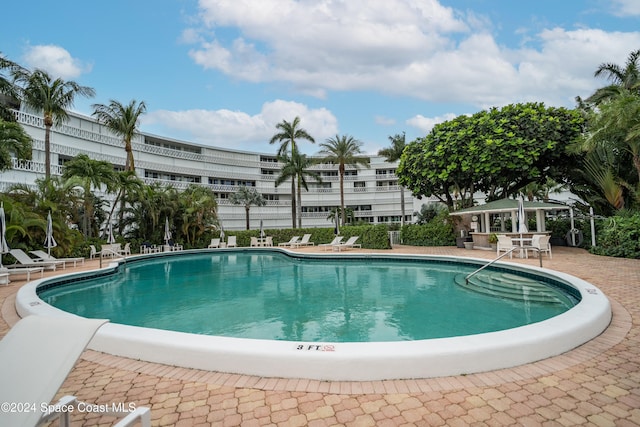 view of pool with a gazebo and a patio