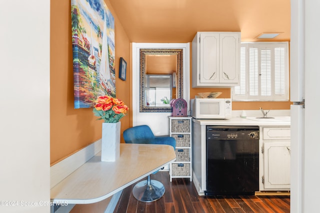 kitchen featuring black dishwasher, dark hardwood / wood-style floors, and white cabinetry