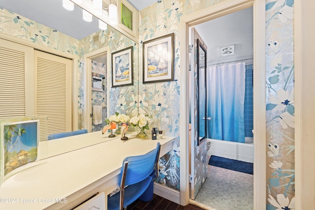 2505 S Ocean Blvd Unit 5030, West Palm Beach, FL 33407 - bathroom with wallpapered walls, vanity, wood finished floors, and shower / bathtub combination with curtain