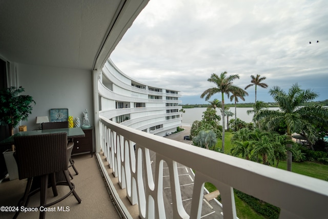 balcony featuring a water view