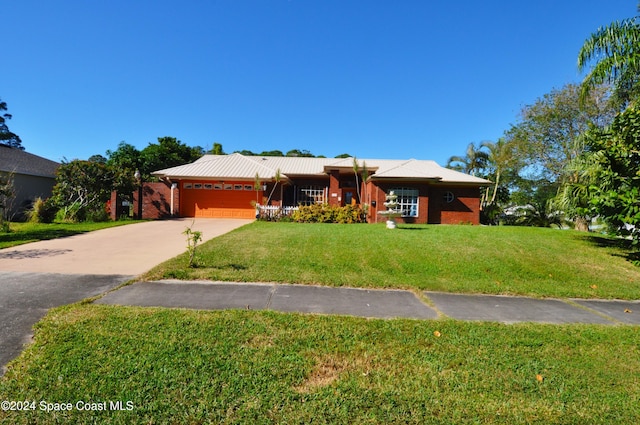 view of front facade with a front lawn and a garage