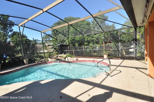 view of pool featuring a patio, pool water feature, and a lanai