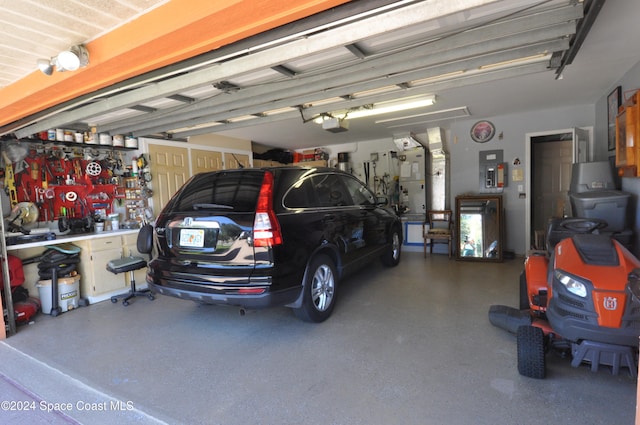 garage featuring a workshop area and a garage door opener