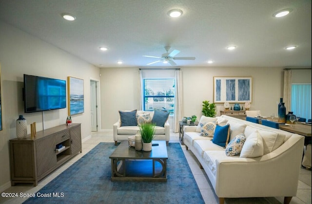 tiled living room with ceiling fan