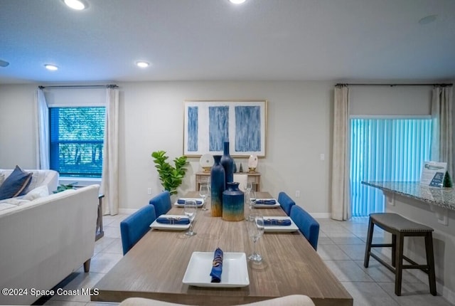 dining area featuring light tile patterned floors