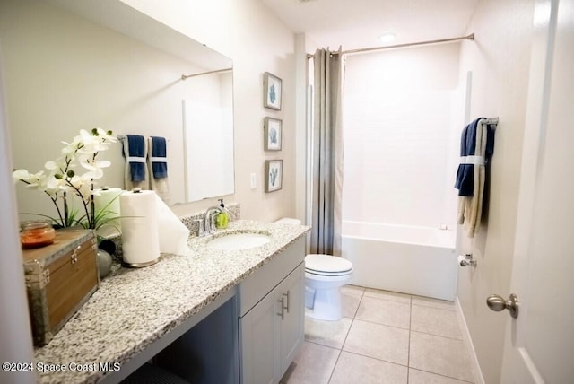 full bathroom featuring tile patterned flooring, vanity, toilet, and shower / bath combo with shower curtain