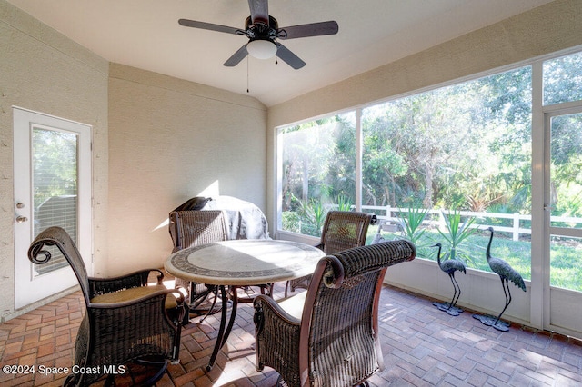 sunroom featuring ceiling fan and a healthy amount of sunlight