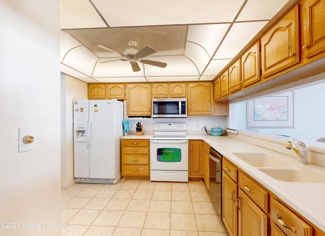 kitchen with ceiling fan, sink, light tile patterned floors, and stainless steel appliances