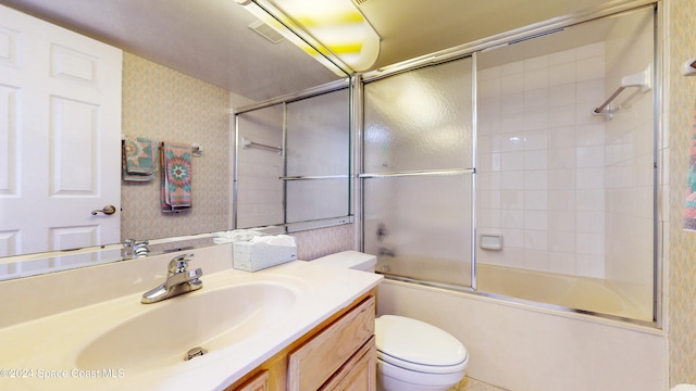 full bathroom with vanity, toilet, and enclosed tub / shower combo