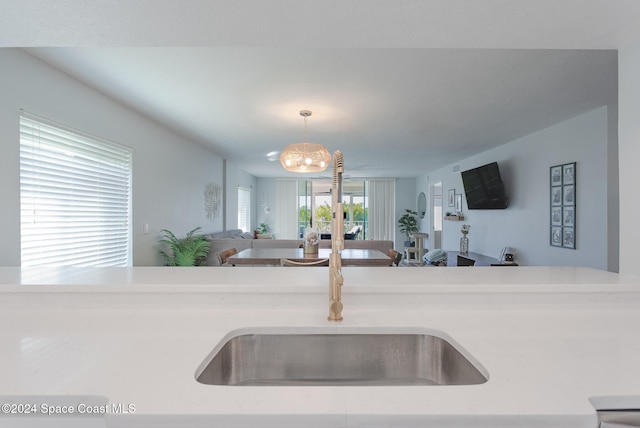 kitchen featuring decorative light fixtures and a notable chandelier