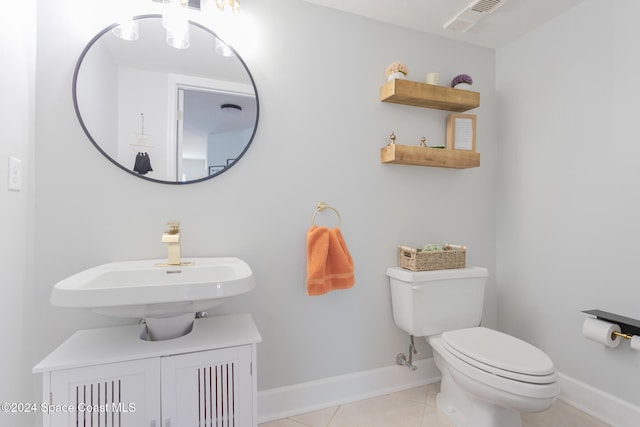 bathroom with tile patterned floors, sink, and toilet