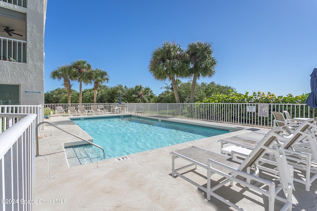 view of swimming pool featuring a patio area