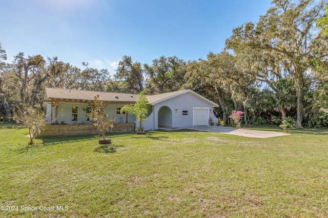 exterior space featuring a garage and a front yard