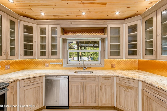 kitchen with light brown cabinetry, sink, and stainless steel appliances