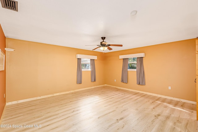 unfurnished room featuring ceiling fan and light hardwood / wood-style floors