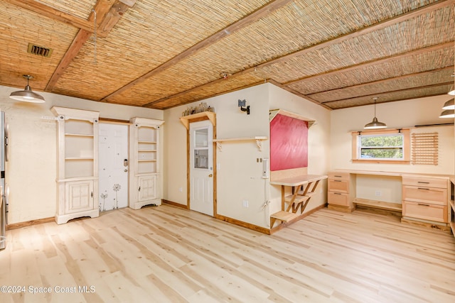 interior space with built in desk and light hardwood / wood-style flooring