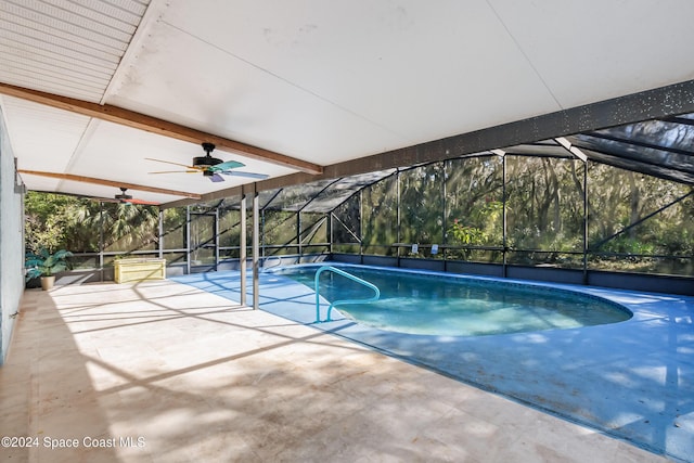 view of pool featuring ceiling fan, a lanai, and a patio