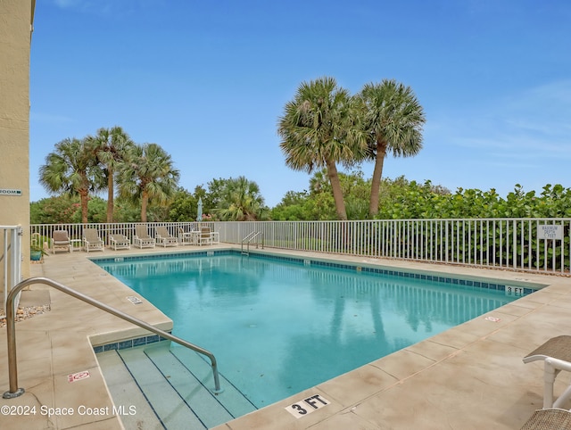 view of swimming pool featuring a patio area