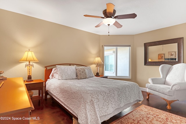 bedroom featuring dark hardwood / wood-style floors and ceiling fan