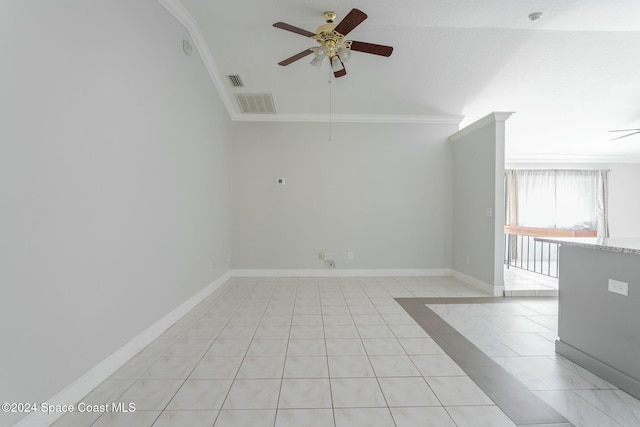 unfurnished room featuring light tile patterned floors, vaulted ceiling, ceiling fan, and crown molding