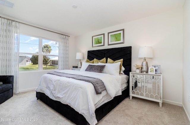 bedroom with light carpet