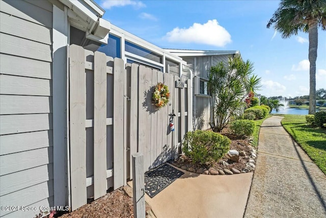 view of side of home featuring a water view