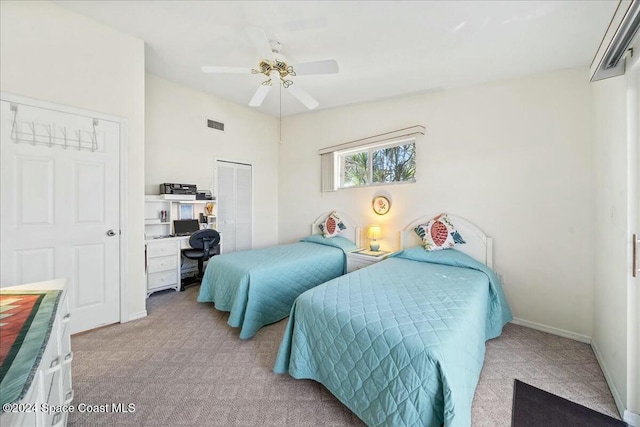 bedroom with light carpet, a closet, and ceiling fan