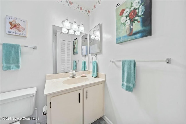 bathroom with vanity and toilet