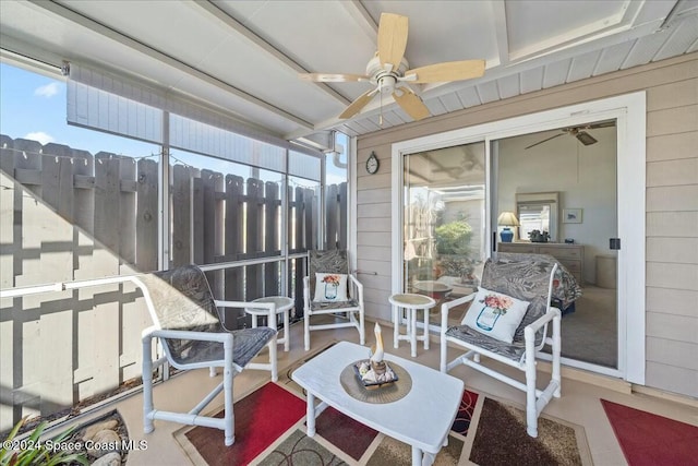 sunroom / solarium with a wealth of natural light and ceiling fan