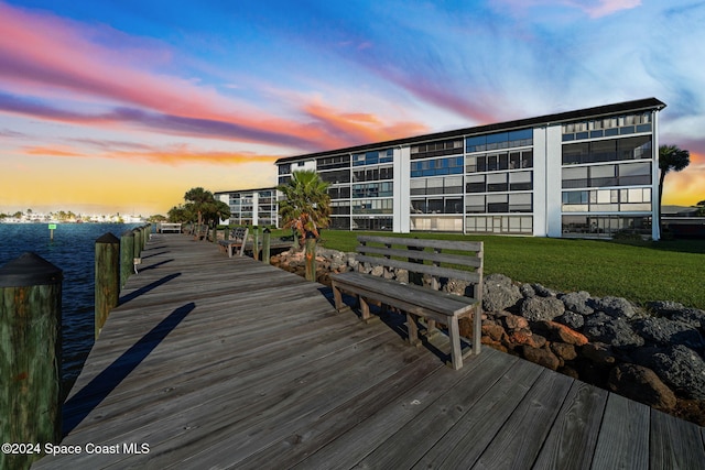 dock area featuring a lawn