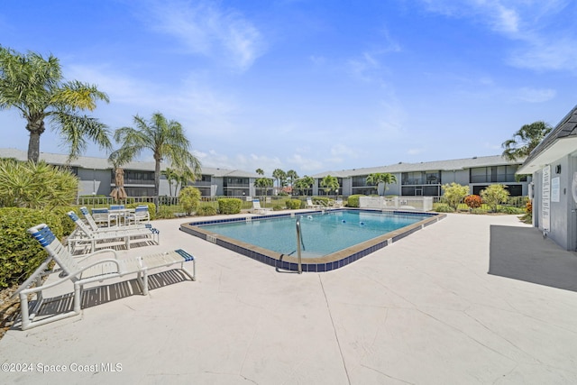 view of swimming pool featuring a patio