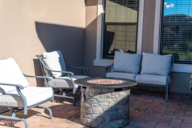 view of patio / terrace featuring a fire pit