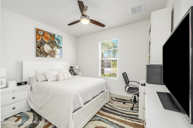 bedroom with ceiling fan and carpet flooring