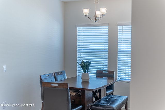 dining space featuring an inviting chandelier