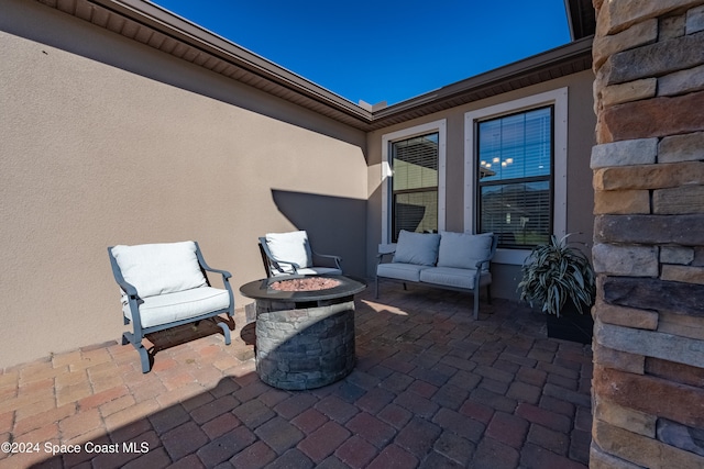 view of patio / terrace with an outdoor fire pit