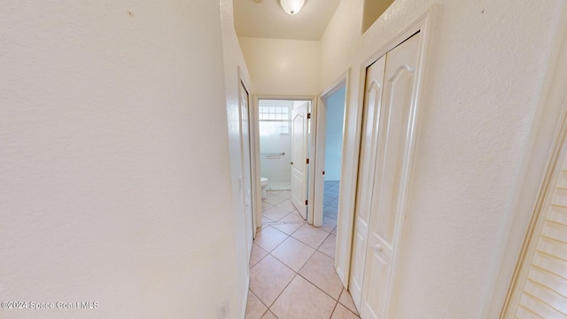 hallway with light tile patterned floors