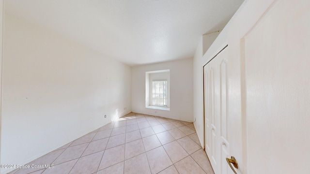 unfurnished bedroom featuring light tile patterned floors