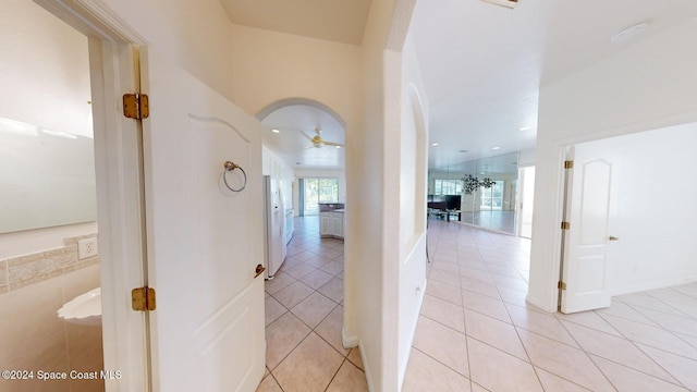 corridor with light tile patterned floors