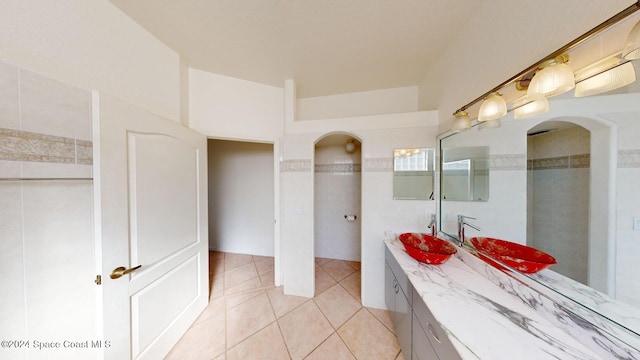 bathroom with tile patterned flooring and vanity