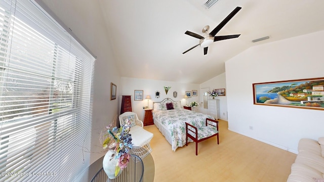 bedroom with light wood-type flooring, ceiling fan, and lofted ceiling