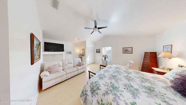 bedroom with ceiling fan and lofted ceiling