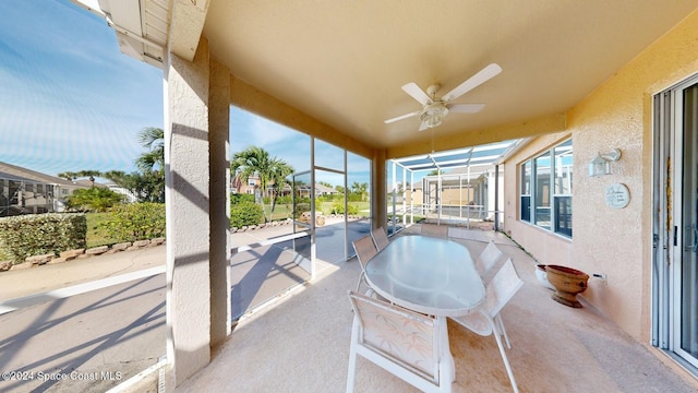 view of patio / terrace with glass enclosure and ceiling fan