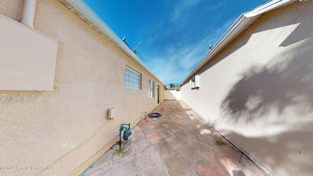 view of side of home featuring a patio area