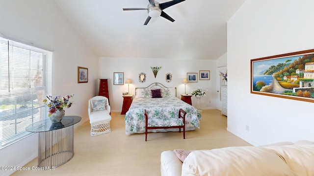 bedroom featuring ceiling fan, light wood-type flooring, and vaulted ceiling