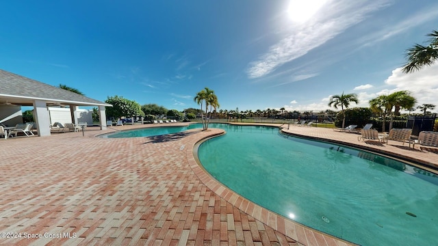 view of swimming pool featuring a patio