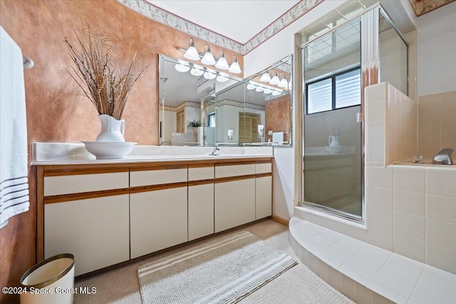 bathroom featuring vanity and an enclosed shower