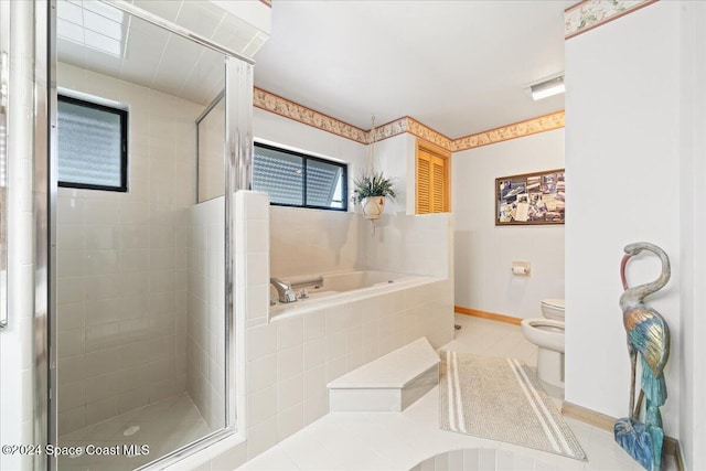 bathroom with tile patterned floors, a bidet, independent shower and bath, and toilet